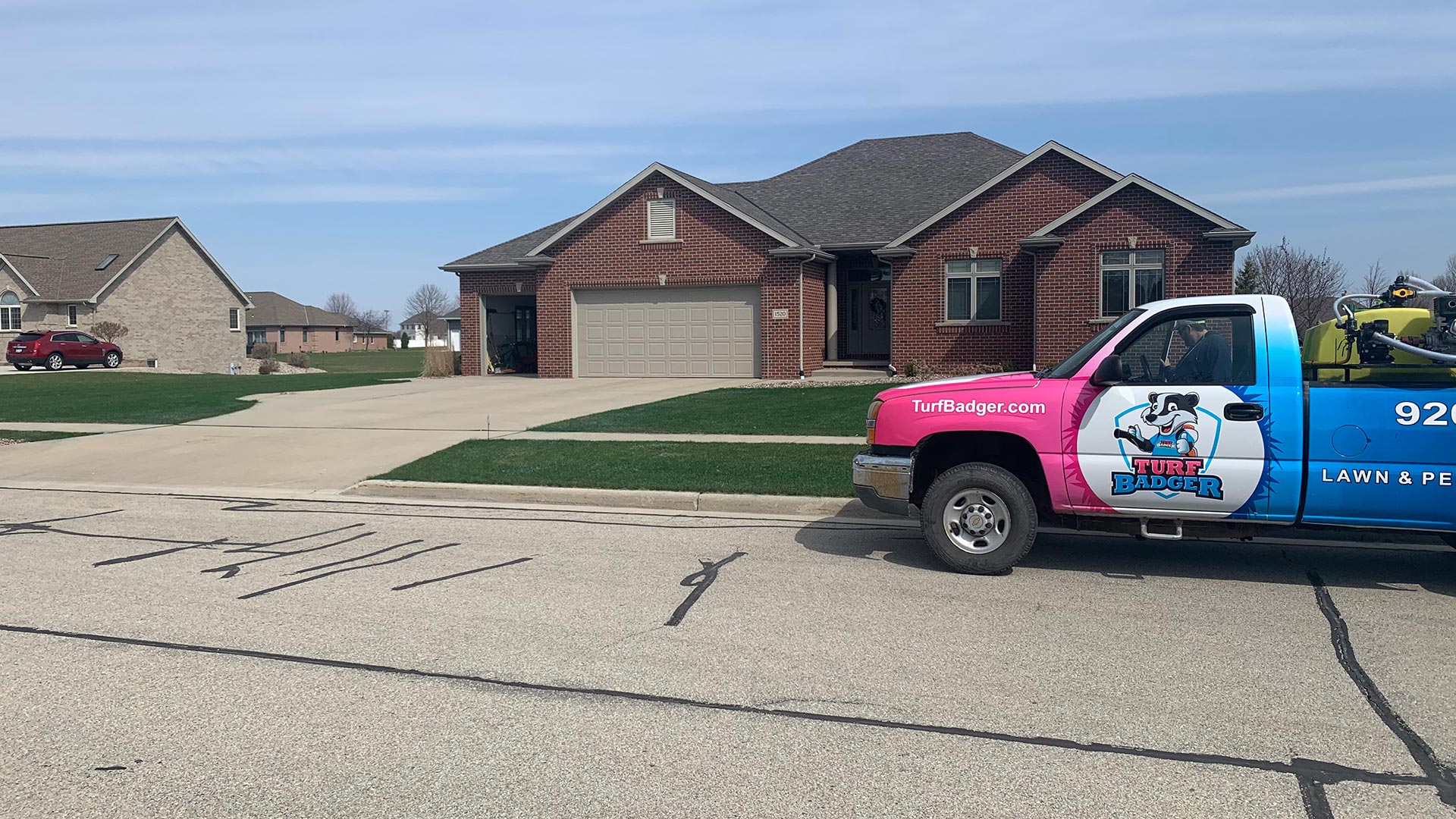 Turf Badger lawn care service truck at a home in Bellevue, Wisconsin.