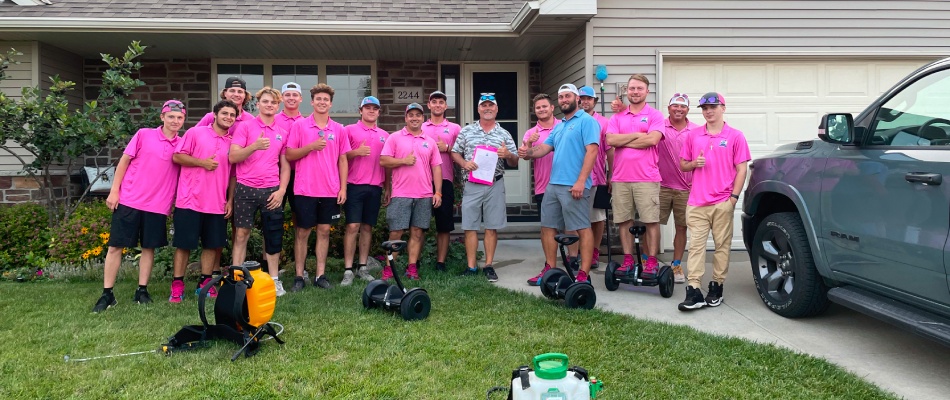 Turf Badger crew posed for a group picture with a client in Kingsford, MI.